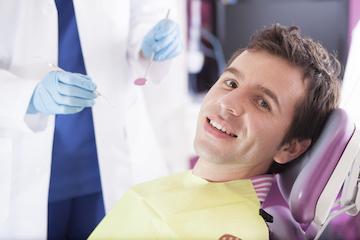 Man receiving tooth extraction at dentist in Mill Creek WA